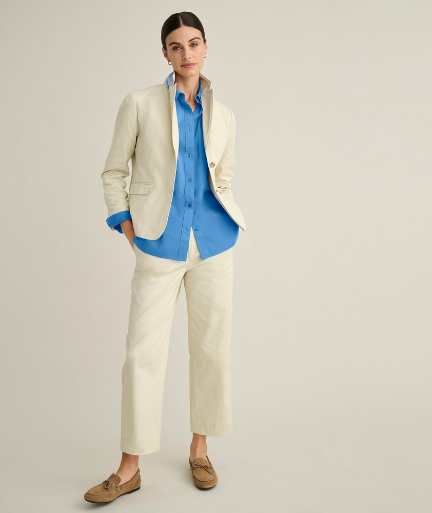 Model is wearing UNTUCKit Ava trousers in tan. 