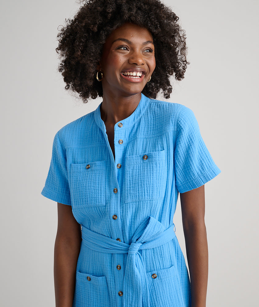 Model is wearing UNTUCKit avry dress in solid blue. 