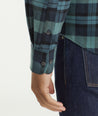 Model is wearing UNTUCKit Flannel Azedo Shirt in Teal & Navy Plaid.