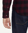 Model is wearing UNTUCKit Flannel Barrelstone Shirt in Maroon & Black Check.