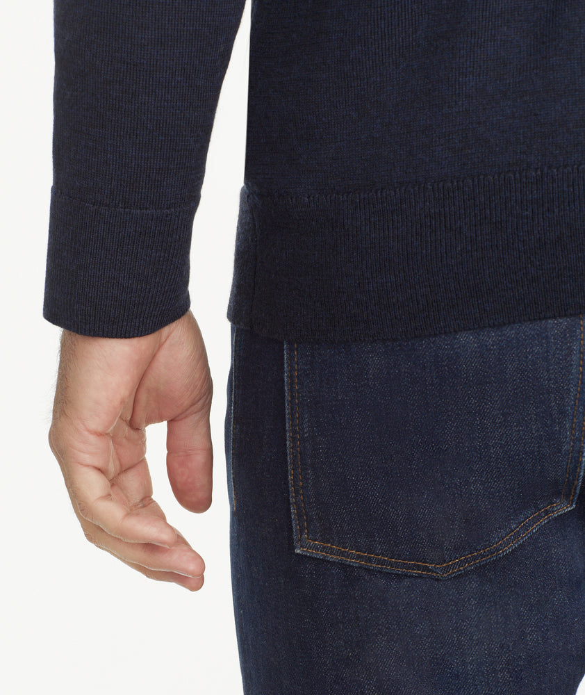 Model is weraring UNTUCKit Belguardo quarter zip in navy.