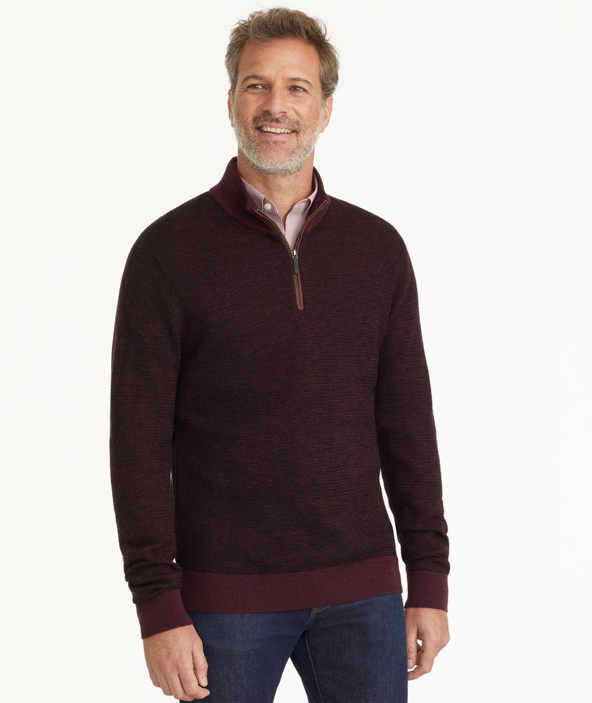 Model is wearing UNTUCKit Birdseye Merino Wool Quarter-Zip Sweater in Deep Purple.