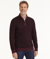 Model is wearing UNTUCKit Birdseye Merino Wool Quarter-Zip Sweater in Deep Purple.