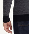 Model is wearing UNTUCKit Birdseye Merino Wool Quarter-Zip Sweater in Heather Navy.