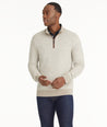 Model is wearing UNTUCKit Birdseye Merino Wool Quarter-Zip Sweater in light silver.