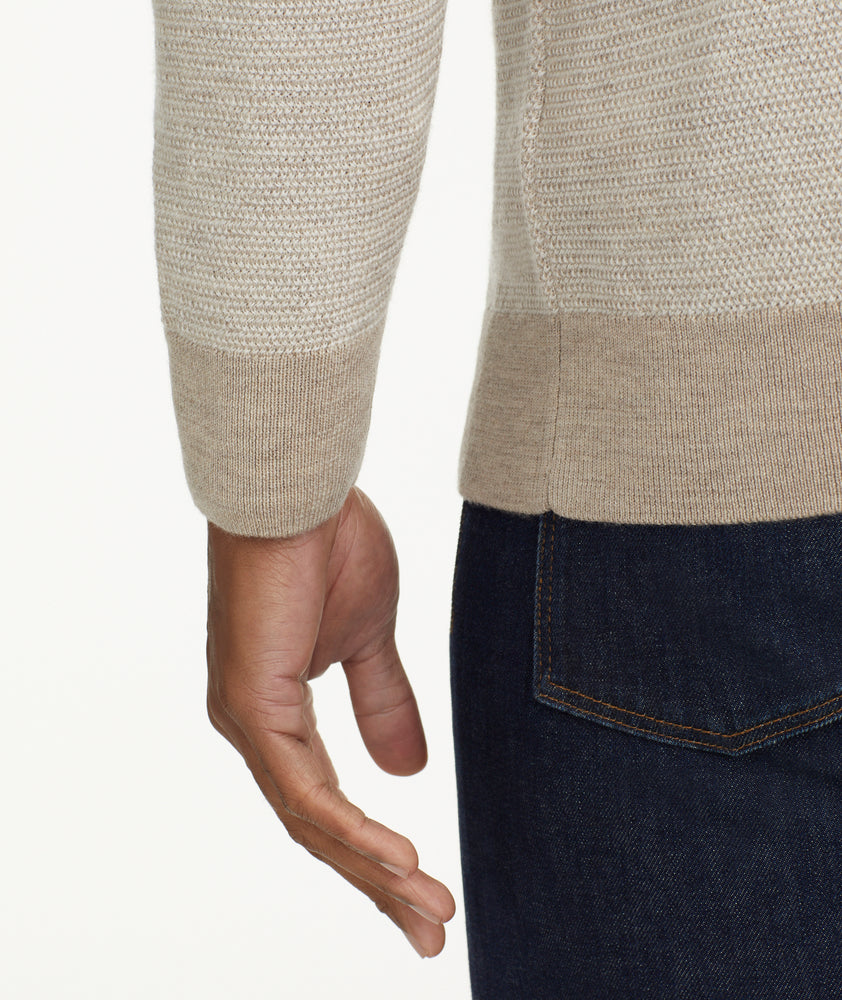 Model is wearing UNTUCKit Birdseye Merino Wool Quarter-Zip Sweater in light silver.
