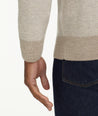 Model is wearing UNTUCKit Birdseye Merino Wool Quarter-Zip Sweater in light silver.