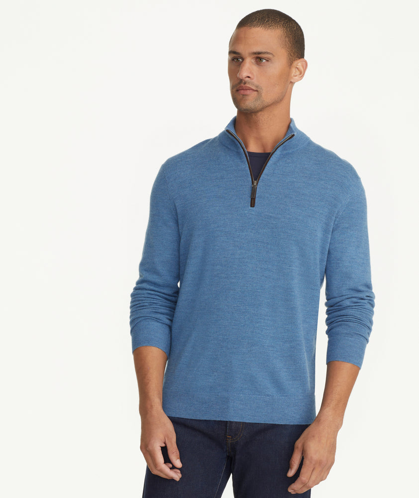 Model is wearing UNTUCKit Belhuardo quart zip in heather blue.