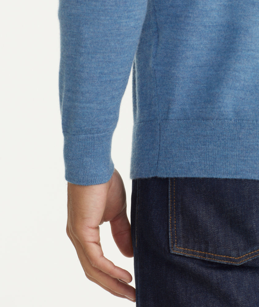 Model is wearing UNTUCKit Belhuardo quart zip in heather blue.