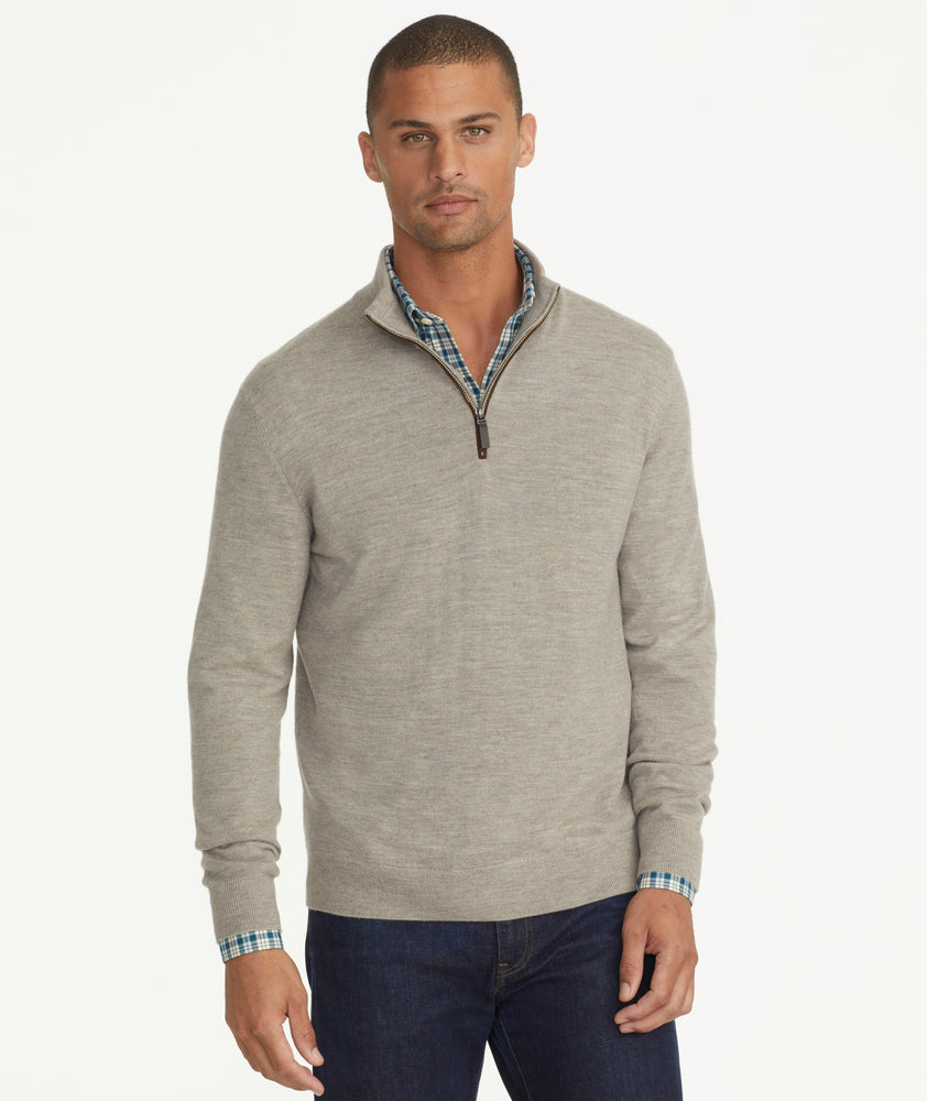 Model is wearing UNTUCKit Belguardo quarter zip in brown.