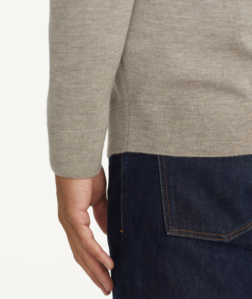 Model is wearing UNTUCKit Belguardo quarter zip in brown.
