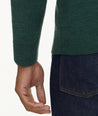 Model is wearing UNTUCKit Merino Wool Quarter-Zip Sweater in Heathered Green With Suede Placket.