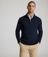 Model is weraring UNTUCKit Belguardo quarter zip in navy.