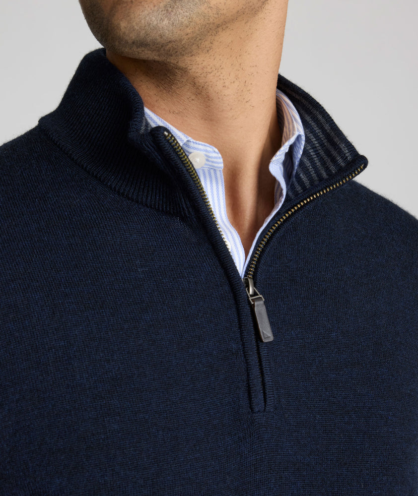 Model is weraring UNTUCKit Belguardo quarter zip in navy.