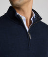 Model is weraring UNTUCKit Belguardo quarter zip in navy.