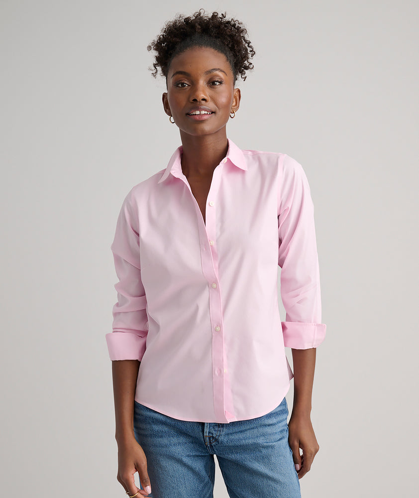 Model is wearing UNTUCKit Bella shirt in pink.