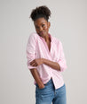 Model is wearing UNTUCKit Bella shirt in pink.