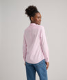 Model is wearing UNTUCKit Bella shirt in pink.