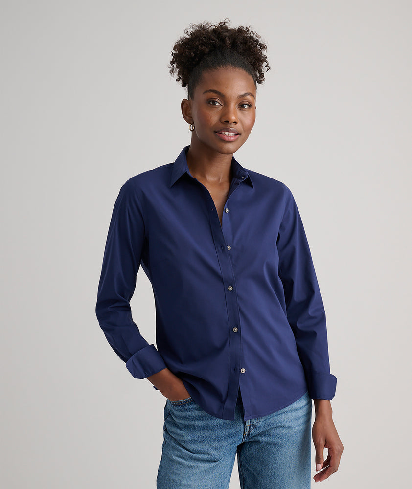 Model is wearing UNTUCKit Bella shirt in navy.
