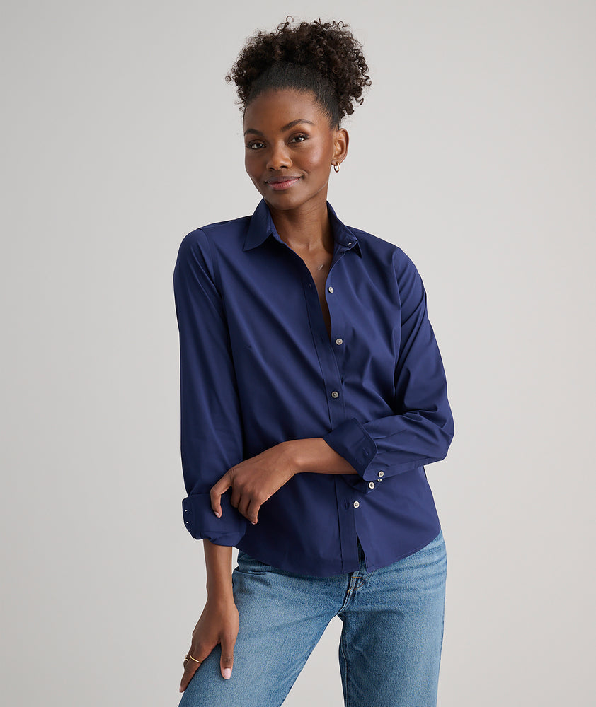 Model is wearing UNTUCKit Bella shirt in navy.