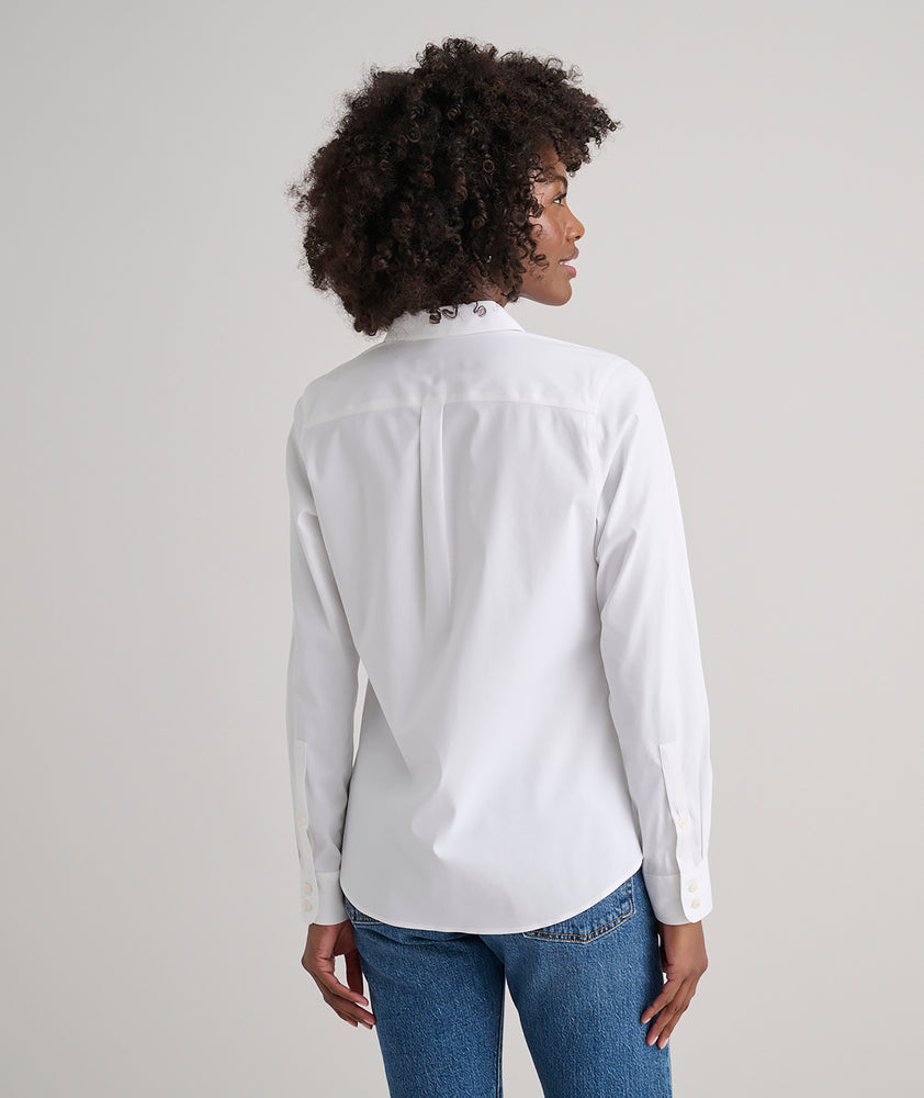 Model is wearing UNTUCKit Bella shirt in white. 