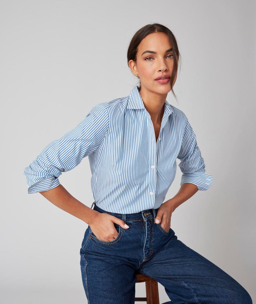 Model is wearing the UNTUCKit Bella Shirt in Blue Stripe. 