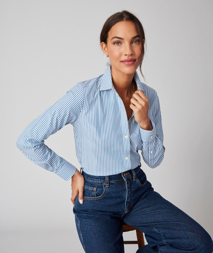 Model is wearing the UNTUCKit Bella Shirt in Blue Stripe. 