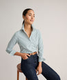 Model is wearing UNTUCKit Wrinkle- Free Cotton Stretch Bella Shirt in green and white strip. 