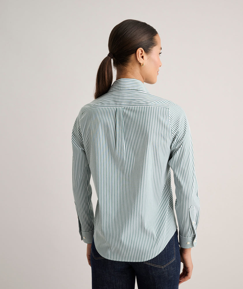 Model is wearing UNTUCKit Wrinkle- Free Cotton Stretch Bella Shirt in green and white strip. 