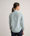 Model is wearing UNTUCKit Wrinkle- Free Cotton Stretch Bella Shirt in green and white strip. 