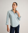 Model is wearing UNTUCKit Wrinkle- Free Cotton Stretch Bella Shirt in green and white strip. 