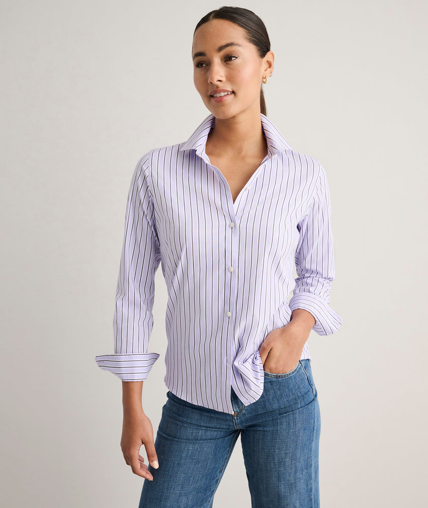 Model is wearing UNTUCKit Wrinkle- Free Cotton Stretch Bella Shirt in purple strip. 