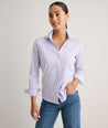 Model is wearing UNTUCKit Wrinkle- Free Cotton Stretch Bella Shirt in purple strip. 