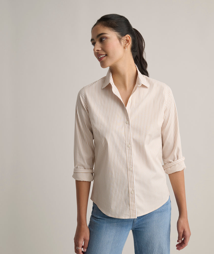 Model is wearing UNTUCKit Bella shirt in tan. 