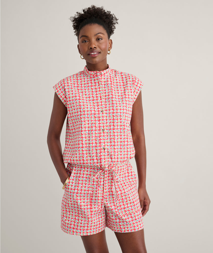 Model is wearing UNTUCKit Ada short in red. 