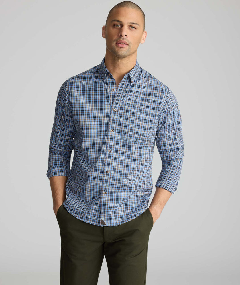Model wearing a blue plaid cottontek shirt.