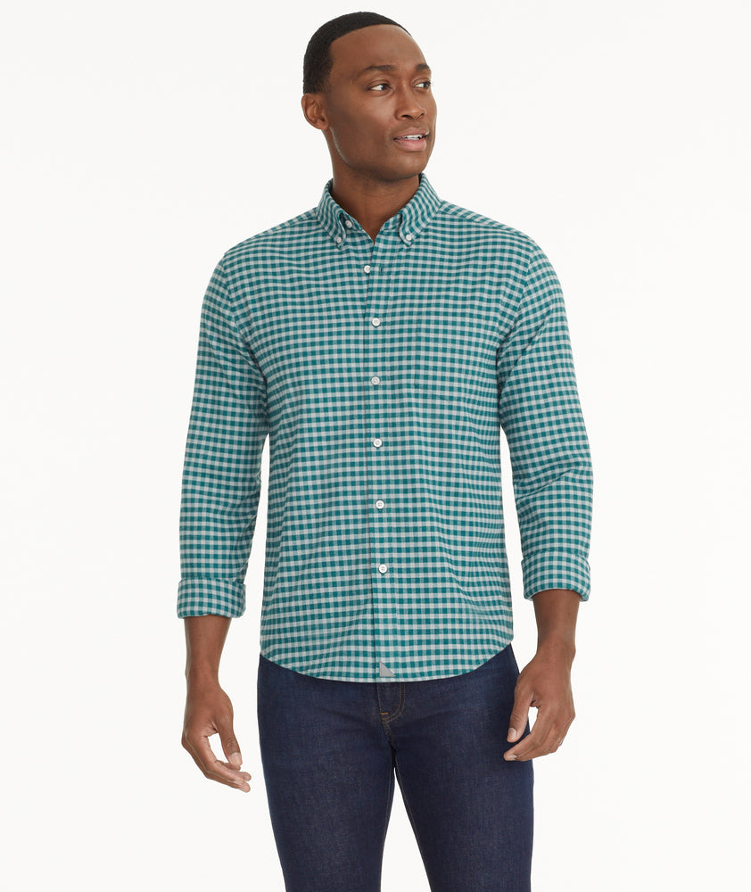 Model is wearing UNTUCKit Wrinkle-Free Performance Flannel Bergstrom Shirt in Green Gingham.