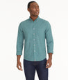 Model is wearing UNTUCKit Wrinkle-Free Performance Flannel Bergstrom Shirt in Green Gingham.