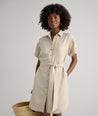 Model is wearing UNTUCKit Betty solid khaki dress. 