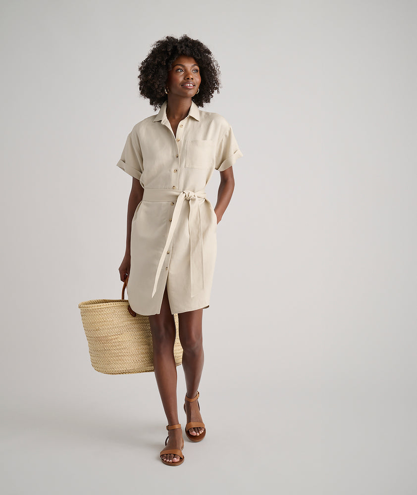 Model is wearing UNTUCKit Betty solid khaki dress. 