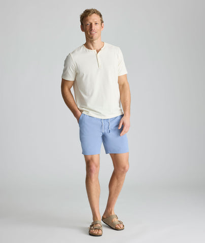 Model is wearing UNTUCKit beyond short in stonewash. 