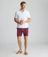 Model is wearing UNTUCKit beyond short in Burgundy. 