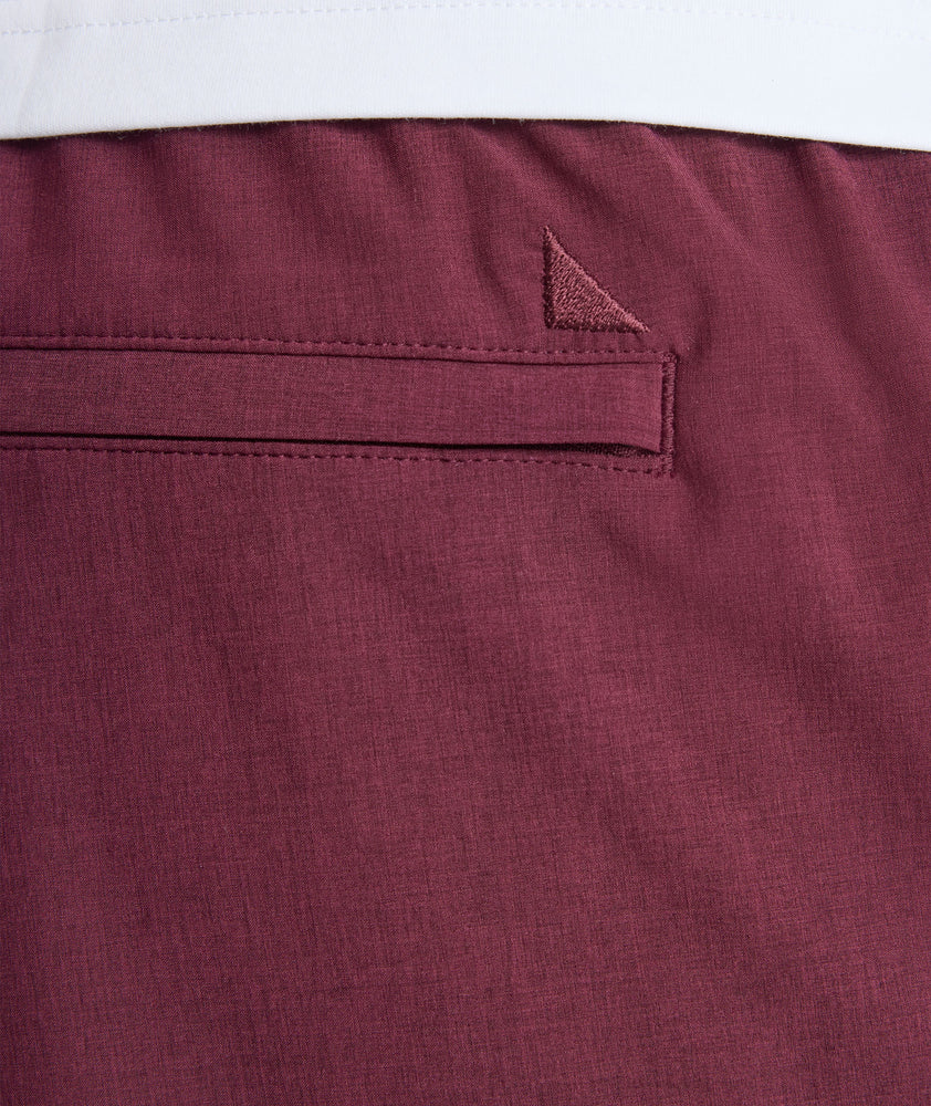 Model is wearing UNTUCKit beyond short in Burgundy. 