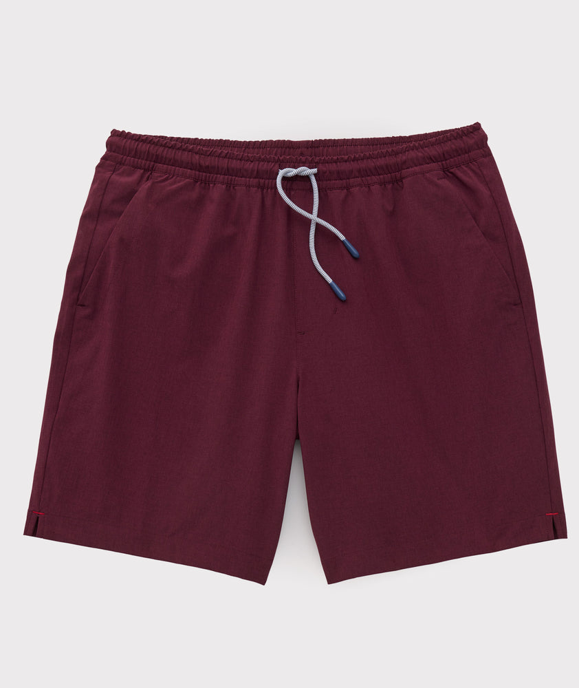 Model is wearing UNTUCKit beyond short in Burgundy. 