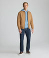 Model is wearing UNTUCKit Waffle-Knit Hoodie Sweater in blue. 