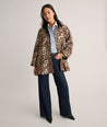 Model is wearing UNTUCKit Black coat in Leopard. 