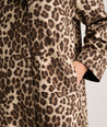 Model is wearing UNTUCKit Black coat in Leopard. 