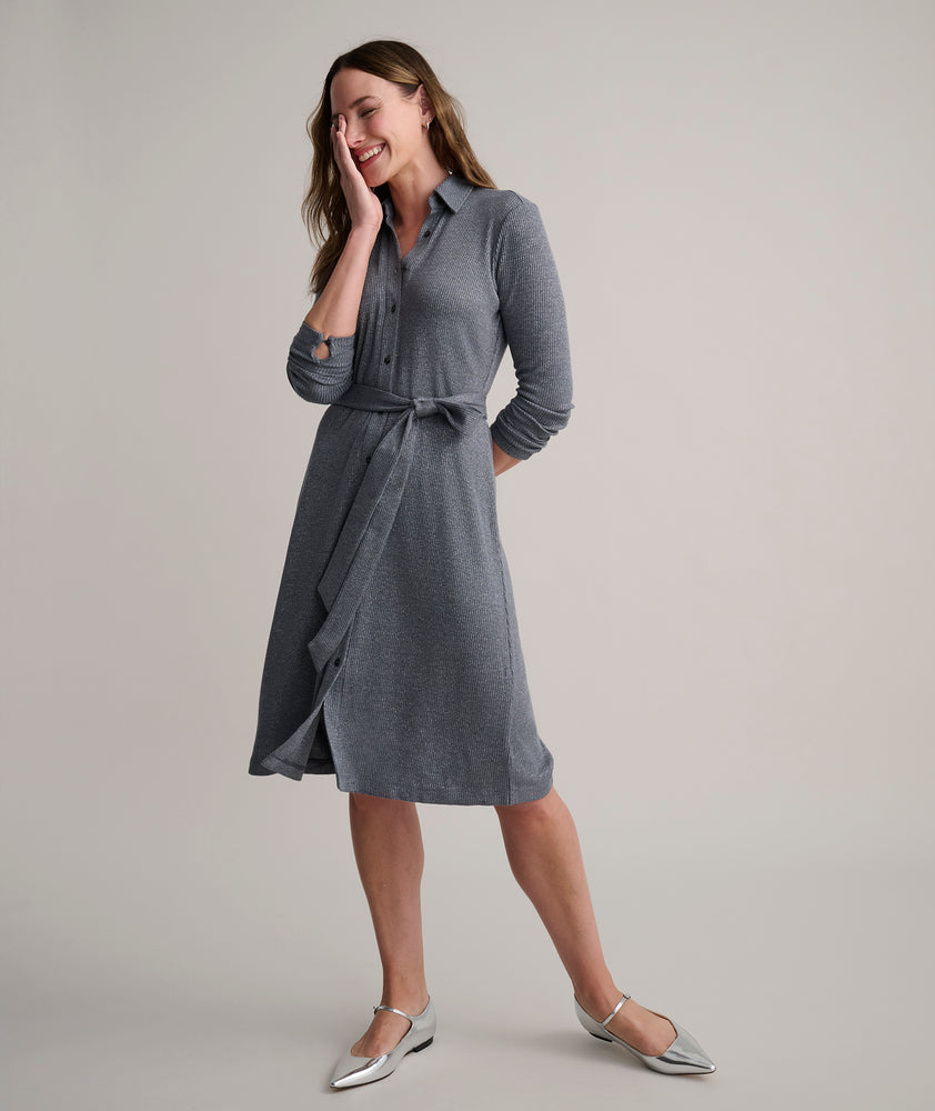 Model is wearing UNTUCKit Blyth dress in solid gray. 