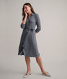 Model is wearing UNTUCKit Blyth dress in solid gray. 