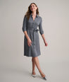 Model is wearing UNTUCKit Blyth dress in solid gray. 
